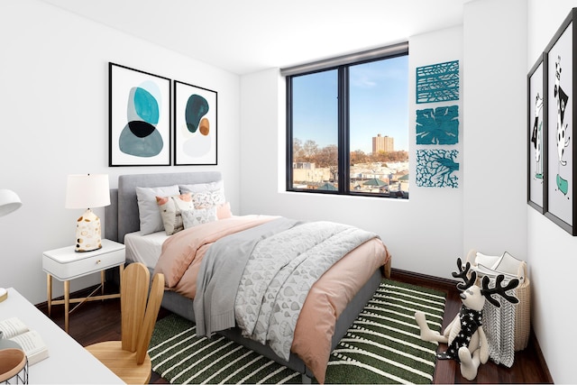 bedroom with wood finished floors