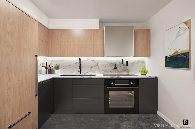 kitchen with modern cabinets, black appliances, light countertops, and a sink