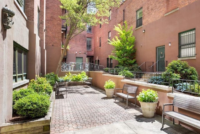 view of patio / terrace featuring fence