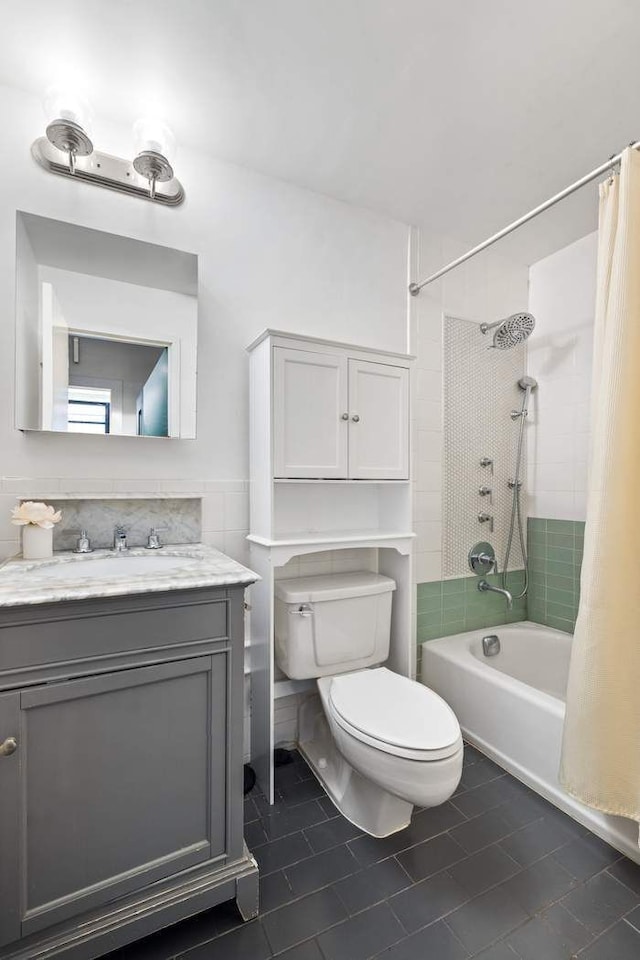 bathroom featuring vanity, toilet, and shower / bath combo with shower curtain