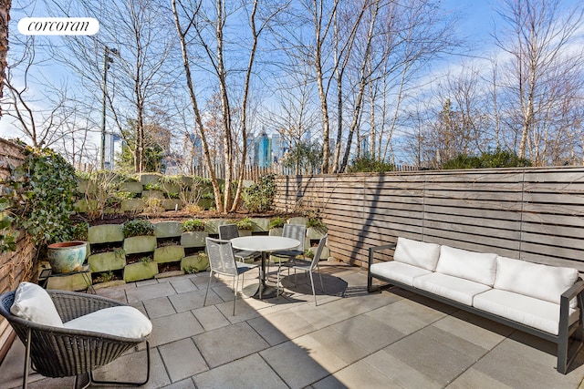 view of patio / terrace with an outdoor living space, outdoor dining area, and a fenced backyard