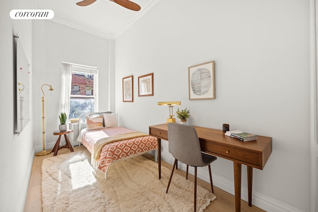 bedroom featuring visible vents, baseboards, ornamental molding, a towering ceiling, and wood finished floors