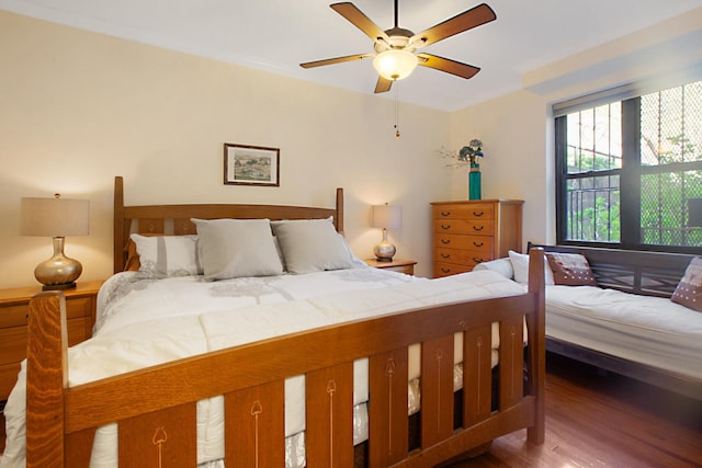 bedroom featuring wood finished floors and ceiling fan