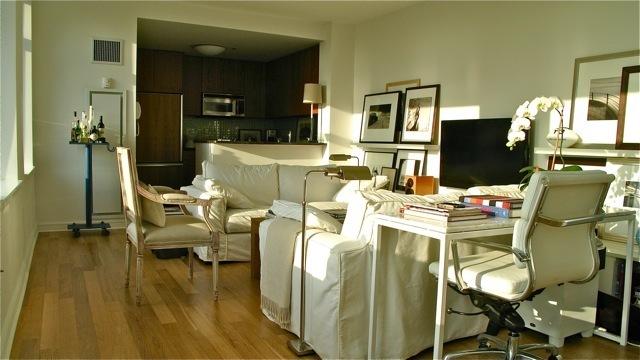 living room with wood finished floors and visible vents