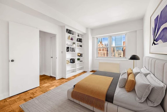 360 W 22nd St Unit 17E, New York City, NY 10011 - bedroom featuring baseboards