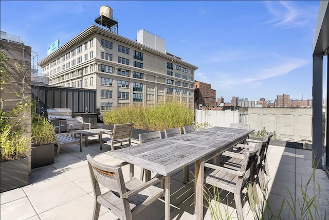 view of patio / terrace with a grill and outdoor dining space