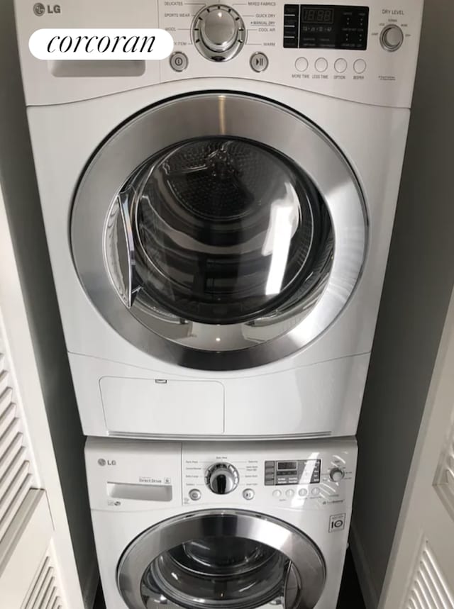 washroom featuring laundry area and stacked washer and dryer