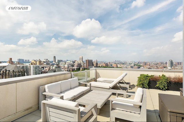 view of patio featuring a view of city, a balcony, outdoor lounge area, and visible vents