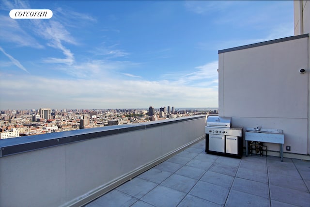 balcony featuring a grill and a view of city