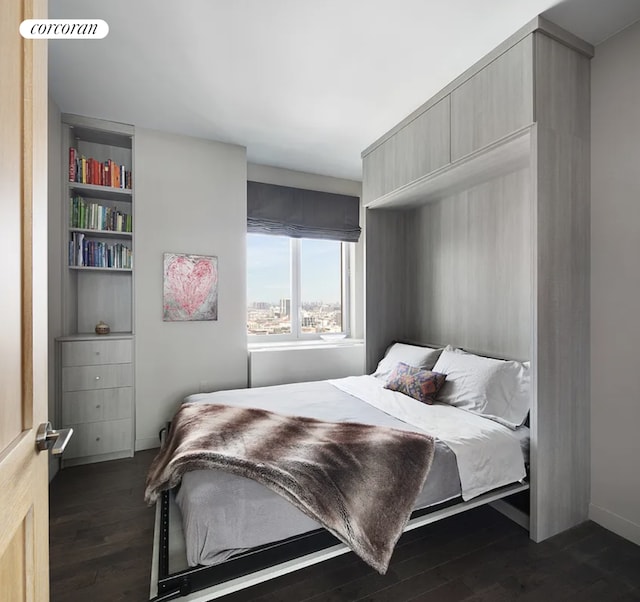 bedroom featuring dark wood-style floors and visible vents