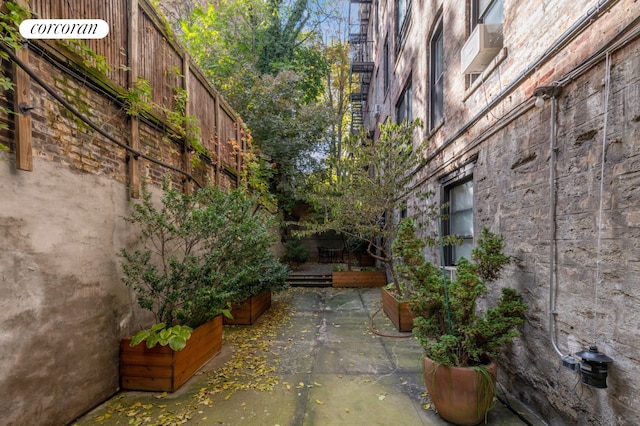 view of side of property featuring a patio area