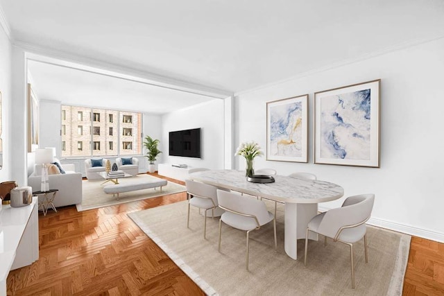 dining room with baseboards and ornamental molding