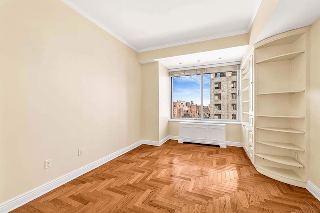 unfurnished room with baseboards and ornamental molding