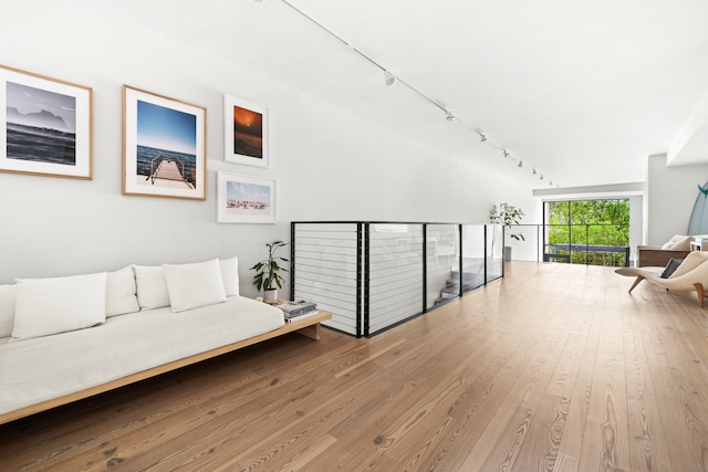 sitting room featuring wood finished floors and track lighting