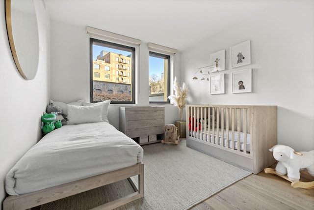 bedroom featuring wood finished floors