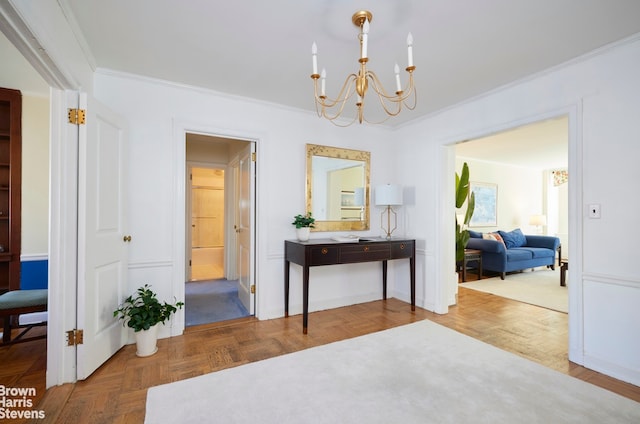 interior space featuring a chandelier and crown molding