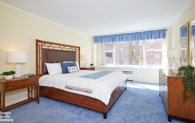 bedroom featuring baseboards, carpet flooring, and crown molding