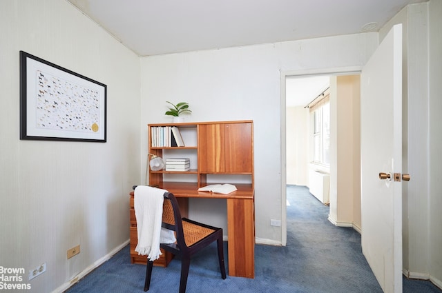 home office featuring baseboards and dark carpet