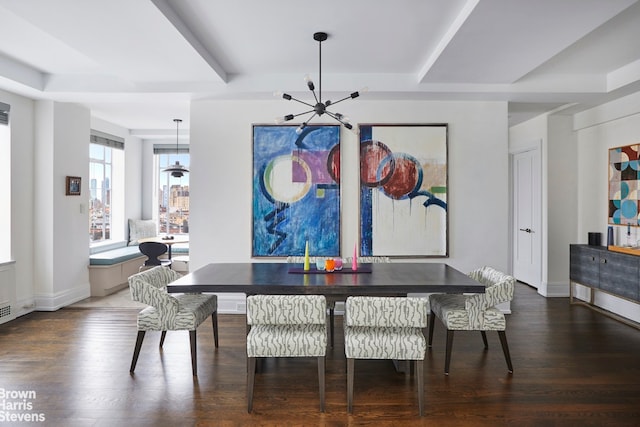 dining area with a chandelier, beamed ceiling, baseboards, and wood finished floors