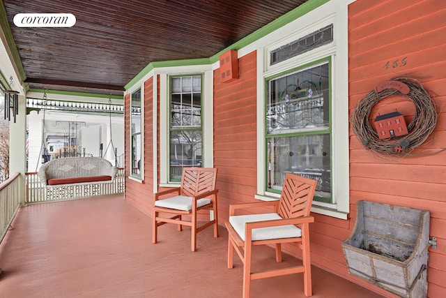 wooden deck featuring covered porch