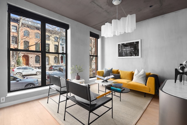 living area featuring a wealth of natural light and wood finished floors