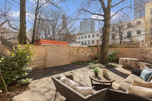 view of patio / terrace featuring a fenced backyard and an outdoor hangout area