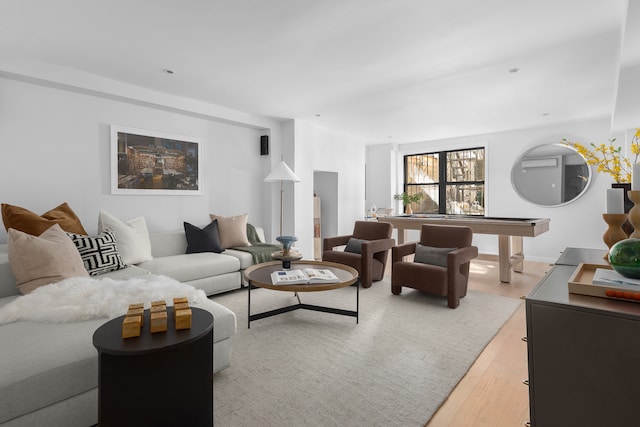 living room featuring light wood-style floors and pool table