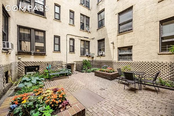 view of patio / terrace with cooling unit and fence