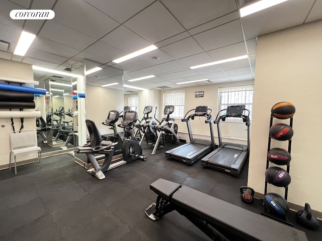 exercise room featuring a drop ceiling and visible vents