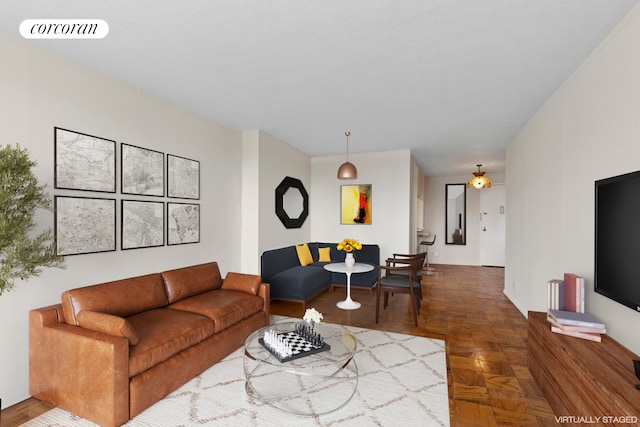 living room featuring visible vents and ceiling fan