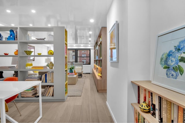 hallway featuring recessed lighting and wood finished floors