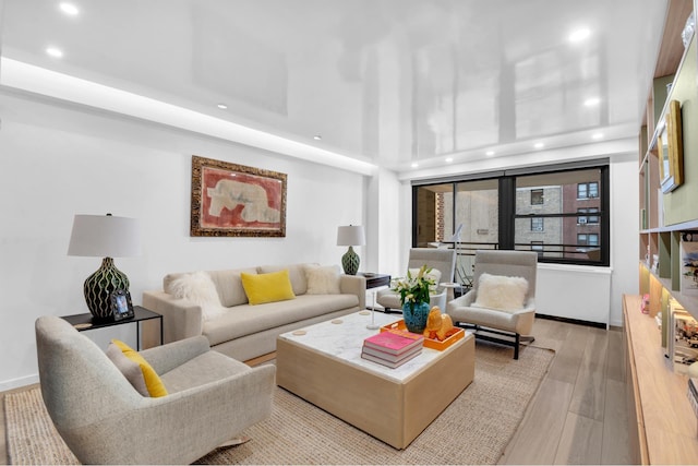 111 E 85th St Unit 10A, New York City, NY 10028 - living room with recessed lighting, wood finished floors, and baseboards