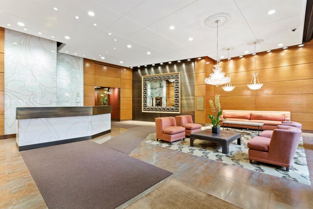 111 E 85th St Unit 10A, New York City, NY 10028 - common area with recessed lighting and wooden walls