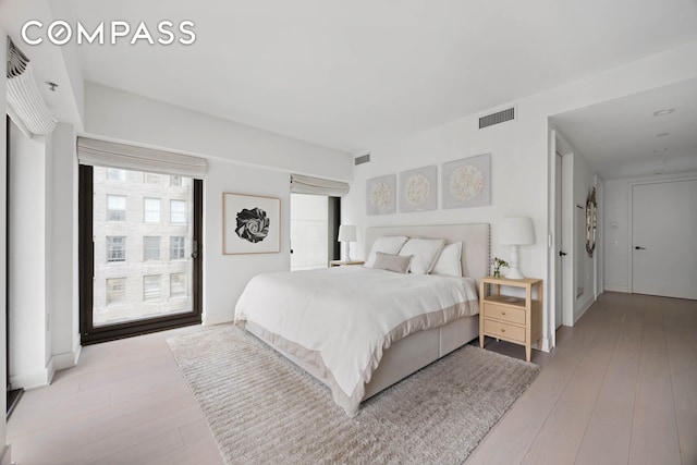 bedroom with light wood finished floors