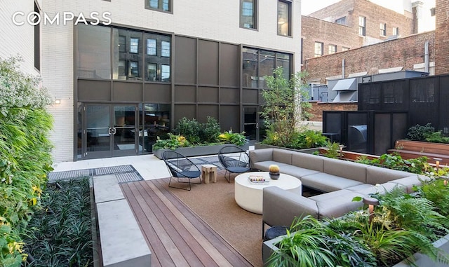 exterior space with an outdoor hangout area and french doors