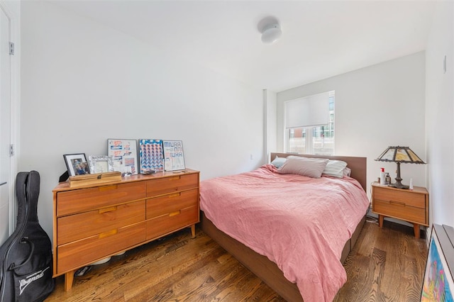 bedroom featuring wood finished floors