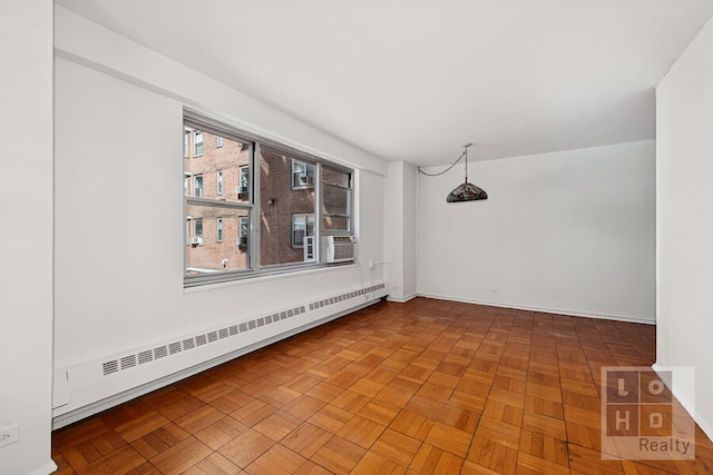 empty room with a baseboard heating unit