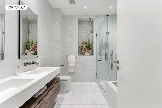 bathroom with toilet, a marble finish shower, marble finish floors, recessed lighting, and double vanity