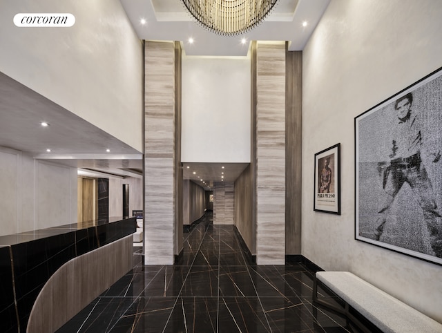 lobby featuring a high ceiling and recessed lighting