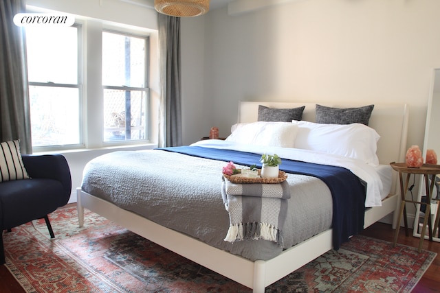 bedroom with wood finished floors