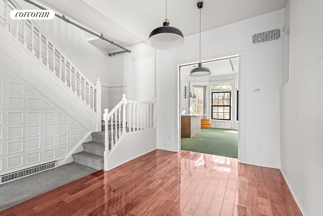 interior space featuring visible vents and wood finished floors