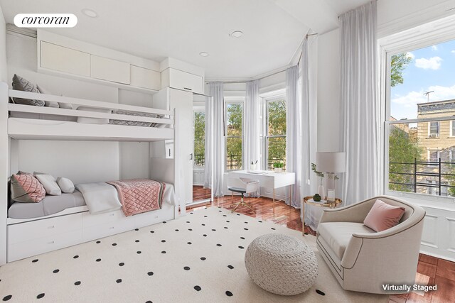 bedroom with visible vents and multiple windows