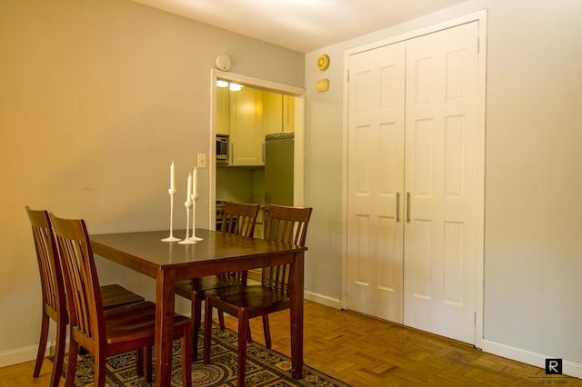 dining space with baseboards