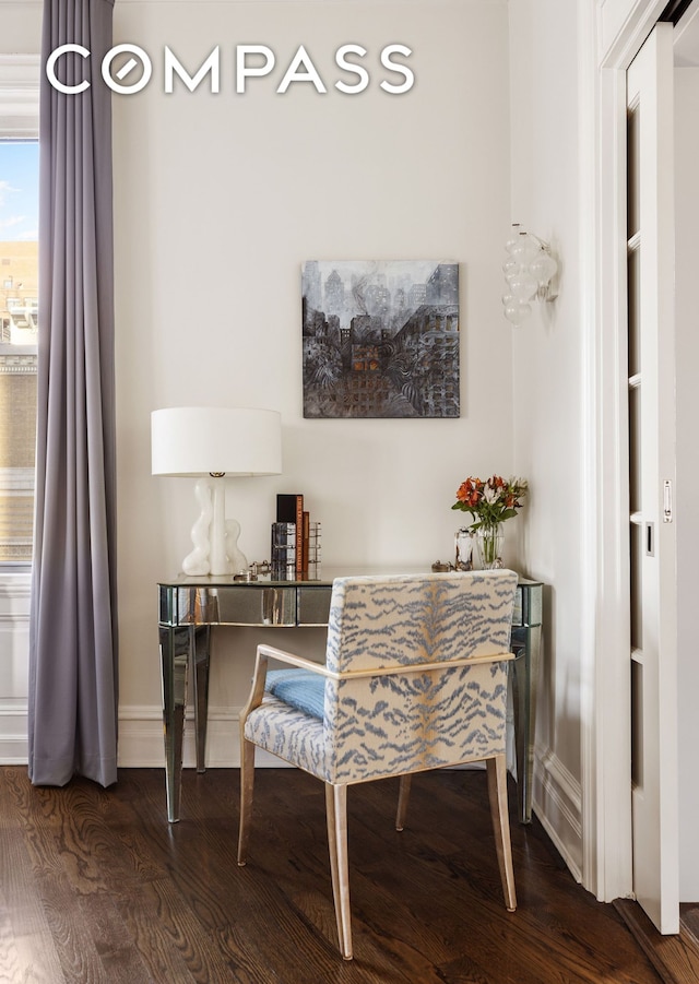 office area with wood finished floors and baseboards