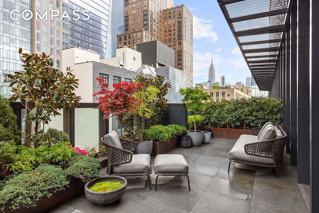 balcony with a patio area and a city view