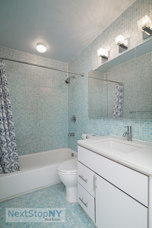 full bathroom with tile patterned floors, toilet, tile walls, and shower / bath combo