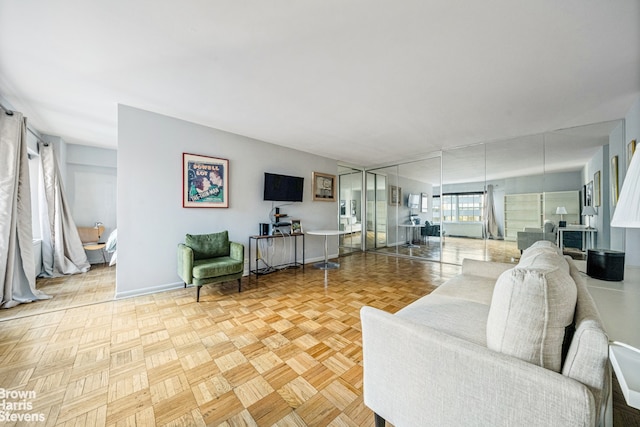 living room featuring baseboards