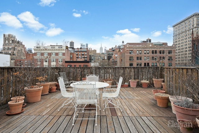 wooden terrace with a view of city