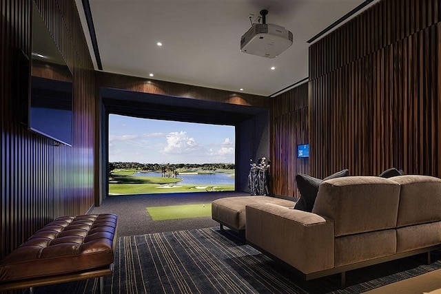 home theater room featuring carpet flooring, golf simulator, recessed lighting, and wood walls