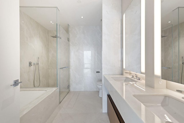 bathroom featuring a shower with door, toilet, a tub with marble appearance, tile walls, and a sink